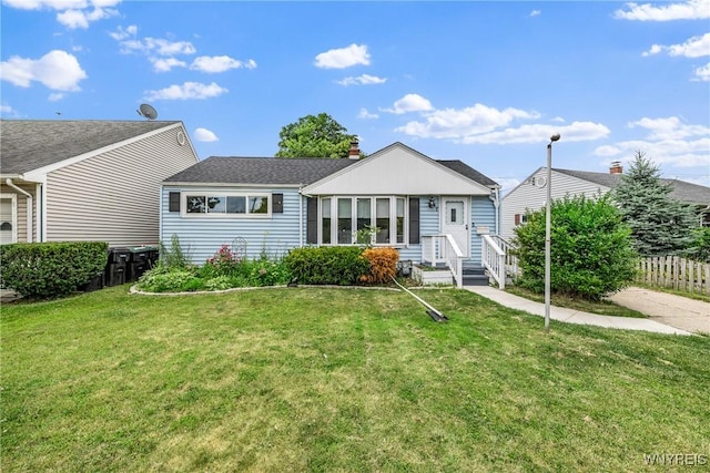 87 Ermann Dr, Tonawanda, NY 14217 - view of front of home featuring a shingled roof and a chimney