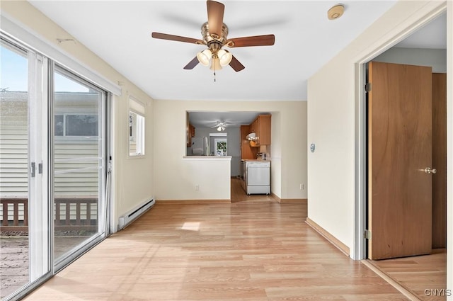 215 Rebecca St, Clay, NY 13212 - hallway with baseboard heating and light wood-style floors