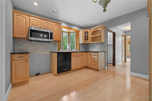 1575 Overhead Rd, Evans, NY 14047 - kitchen featuring stainless steel microwave, dishwasher, backsplash, light wood-style flooring, and dark countertops