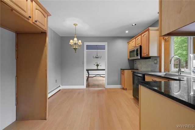 1575 Overhead Rd, Evans, NY 14047 - kitchen with dishwasher, stainless steel microwave, a baseboard heating unit, a chandelier, and light wood-style floors