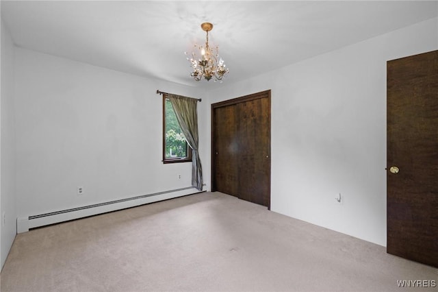 1575 Overhead Rd, Evans, NY 14047 - unfurnished bedroom with a baseboard radiator, a chandelier, carpet, and a closet