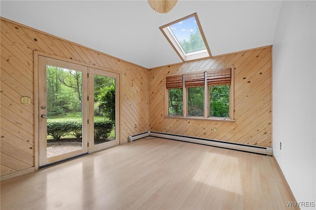 1575 Overhead Rd, Evans, NY 14047 - unfurnished room featuring a baseboard heating unit, a skylight, wood finished floors, and wood walls