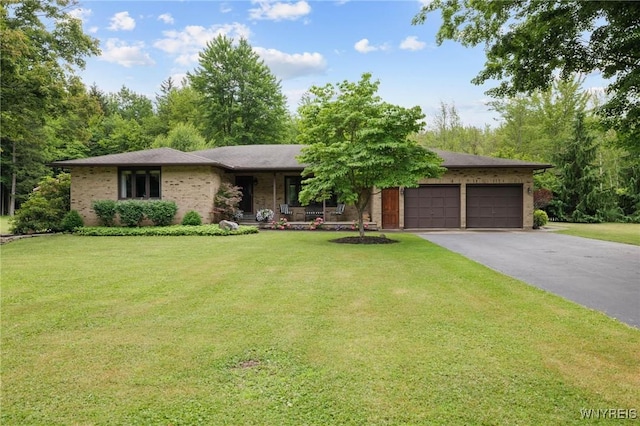 1575 Overhead Rd, Evans, NY 14047 - view of front facade with a garage, driveway, covered porch, a front yard, and brick siding