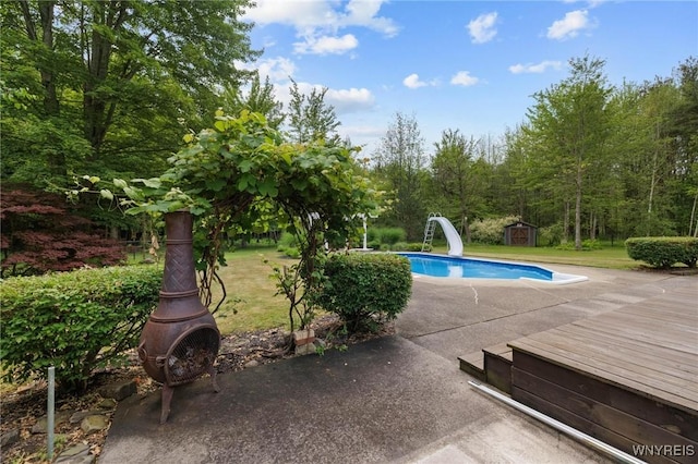 1575 Overhead Rd, Evans, NY 14047 - outdoor pool with a water slide, a storage shed, and a lawn