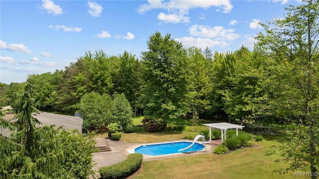 1575 Overhead Rd, Evans, NY 14047 - swimming pool with a pergola, a lawn, a wooded view, and a patio