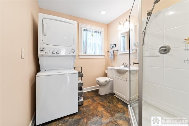49 Day St, Pomfret, NY 14063 - bathroom featuring stacked washing machine and dryer, stone finish floors, a shower stall, and vanity