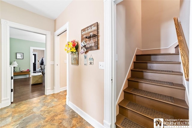 49 Day St, Pomfret, NY 14063 - stairway with baseboards and stone finish floors