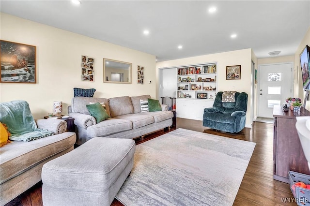 2051 Parker Blvd, Tonawanda, NY 14150 - living area with dark wood-style flooring, recessed lighting, and built in shelves