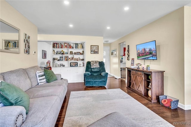 2051 Parker Blvd, Tonawanda, NY 14150 - living area with dark wood-style floors, recessed lighting, and built in shelves
