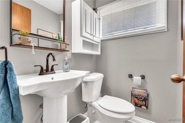 2051 Parker Blvd, Tonawanda, NY 14150 - half bathroom featuring toilet and a sink