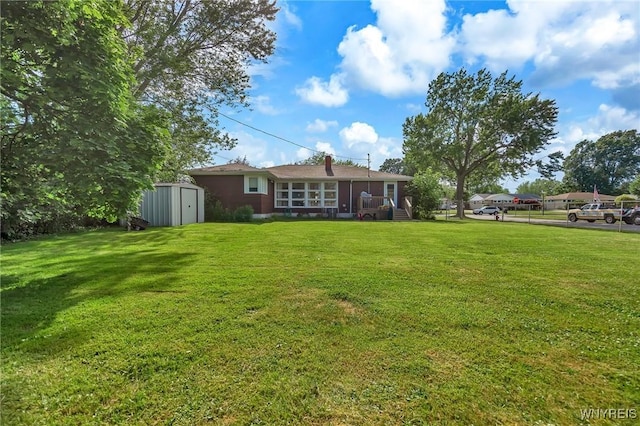 2051 Parker Blvd, Tonawanda, NY 14150 - view of green lawn featuring a shed and a sunroom