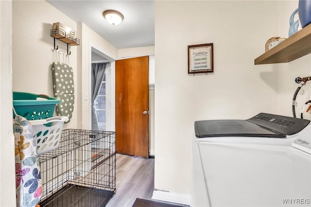 2051 Parker Blvd, Tonawanda, NY 14150 - washroom featuring washer and dryer and wood finished floors
