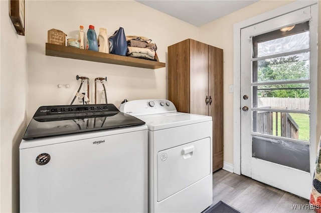 2051 Parker Blvd, Tonawanda, NY 14150 - washroom featuring washing machine and dryer and light wood finished floors