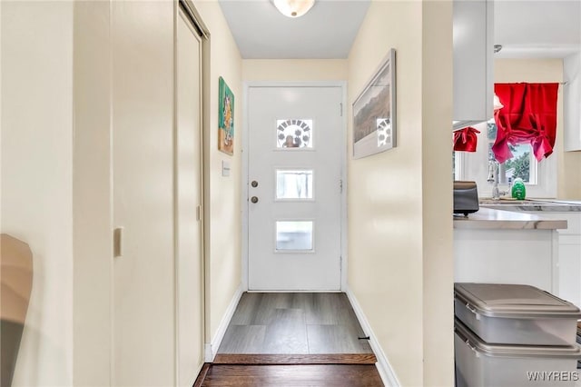 2051 Parker Blvd, Tonawanda, NY 14150 - doorway to outside featuring wood finished floors and baseboards