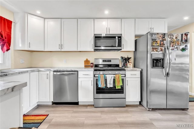 2051 Parker Blvd, Tonawanda, NY 14150 - kitchen with stainless steel appliances, white cabinets, and recessed lighting