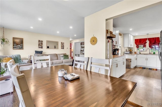 2051 Parker Blvd, Tonawanda, NY 14150 - dining space featuring light wood-style flooring and recessed lighting