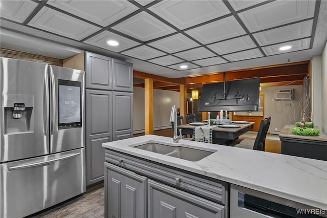 722 College Ter, Niagara Falls, NY 14305 - kitchen with stainless steel appliances, gray cabinetry, light stone counters, wood finished floors, and recessed lighting