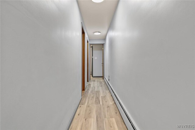 722 College Ter, Niagara Falls, NY 14305 - corridor featuring light wood-style floors and a baseboard radiator