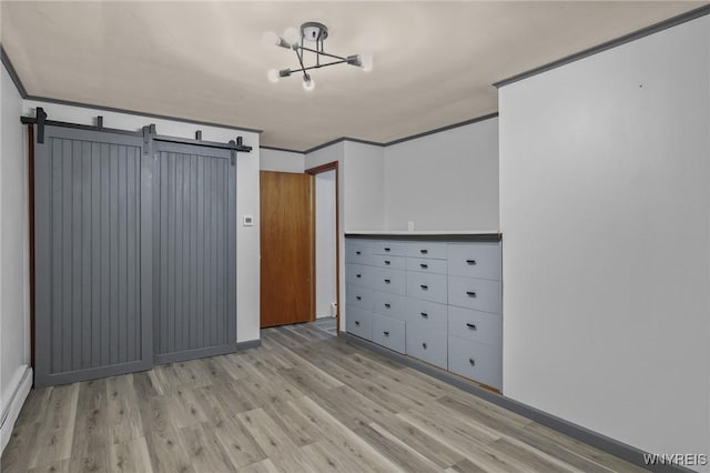 722 College Ter, Niagara Falls, NY 14305 - unfurnished bedroom featuring wood finished floors, a chandelier, crown molding, a baseboard radiator, and a barn door