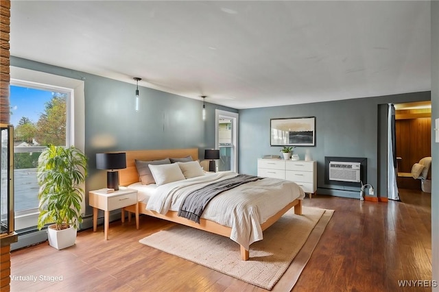722 College Ter, Niagara Falls, NY 14305 - bedroom with wood finished floors and a wall unit AC