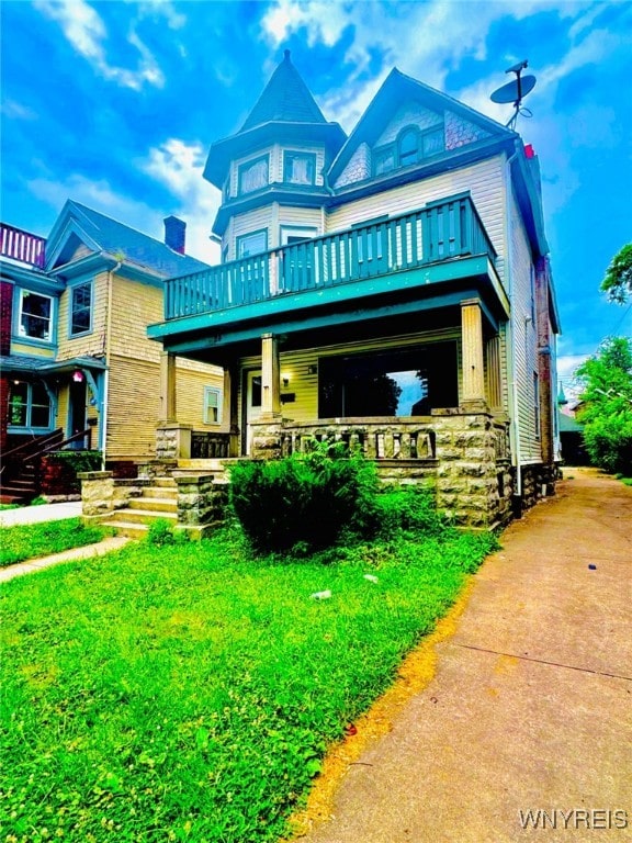24 Northrup Pl, Buffalo, NY 14214 - victorian home featuring a balcony and a porch