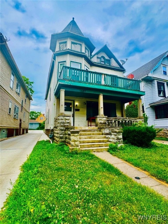 24 Northrup Pl, Buffalo, NY 14214 - victorian-style house with a porch and a front lawn