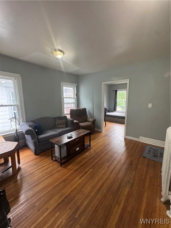 24 Northrup Pl, Buffalo, NY 14214 - living area featuring dark wood-style floors and baseboards