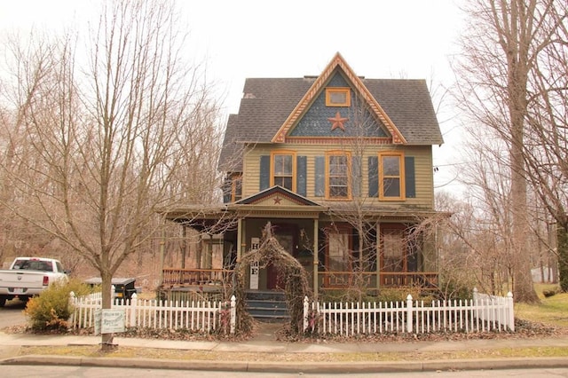 8 Ithaca St, Barton, NY 14892 - victorian house with a porch, roof with shingles, and a fenced front yard