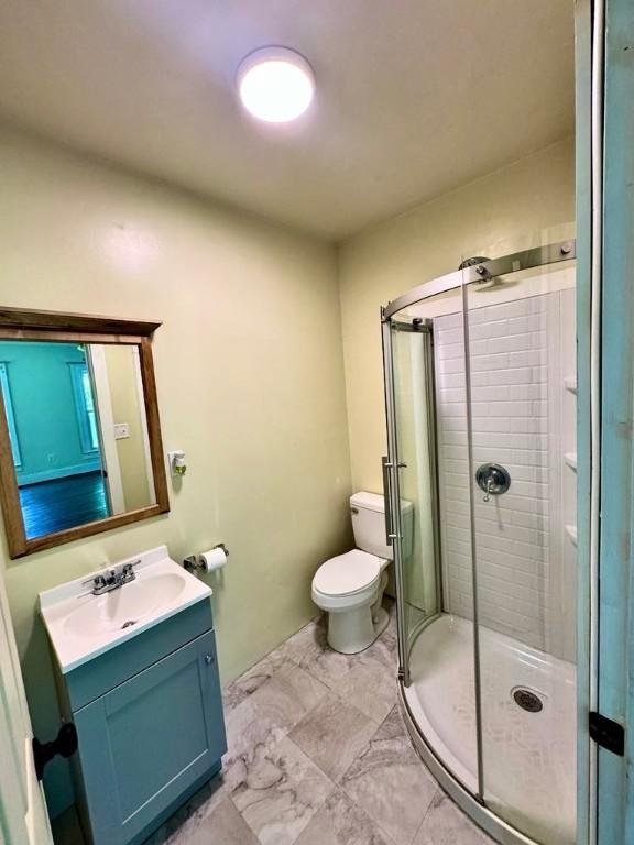 8 Ithaca St, Barton, NY 14892 - bathroom featuring vanity, a stall shower, and marble finish floors