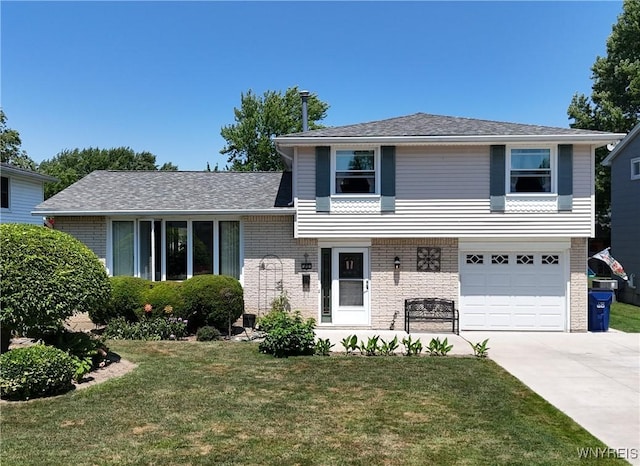 80 Jeffrey Dr, Amherst, NY 14228 - tri-level home featuring concrete driveway, brick siding, a front yard, and an attached garage