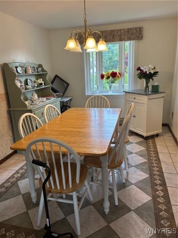 80 Jeffrey Dr, Amherst, NY 14228 - dining space with a chandelier and baseboards