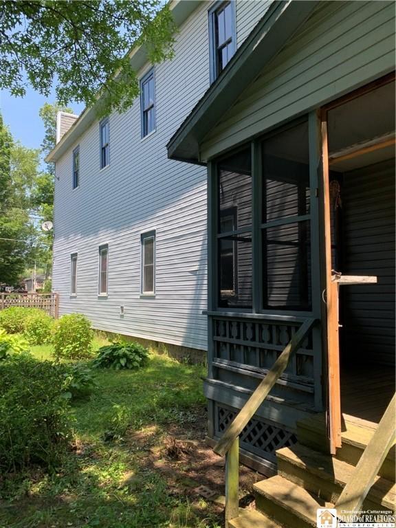 749-753 W Main, Ellington, NY 14732 - view of home's exterior with a chimney