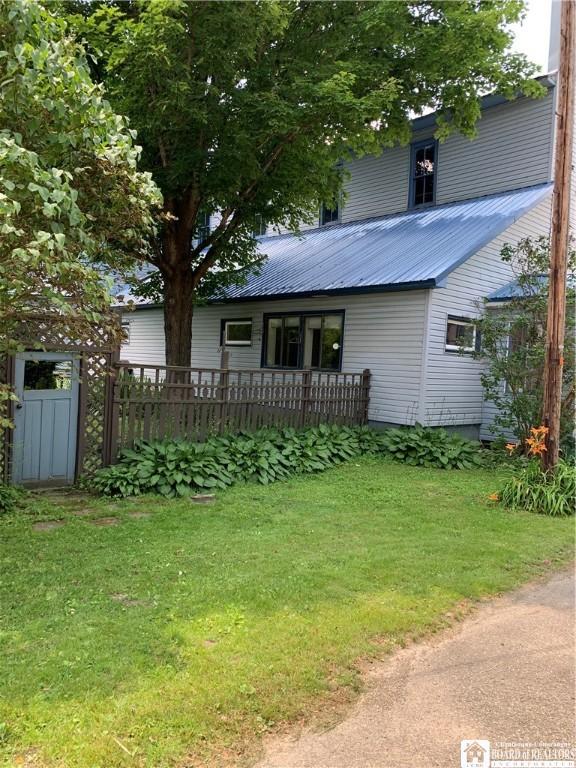 749-753 W Main, Ellington, NY 14732 - view of front of home featuring a front yard and a metal roof