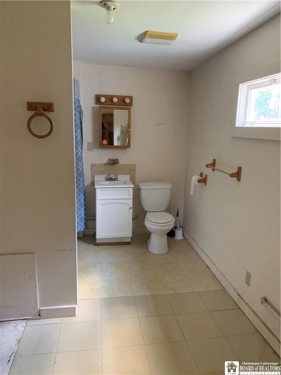 749-753 W Main, Ellington, NY 14732 - full bathroom with toilet and vanity