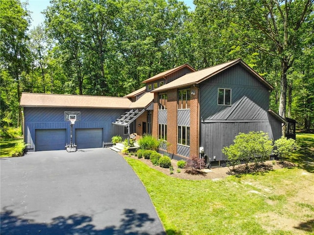 2657 Spencer Hill Rd, Corning, NY 14830 - view of front facade with asphalt driveway, an attached garage, and a front lawn