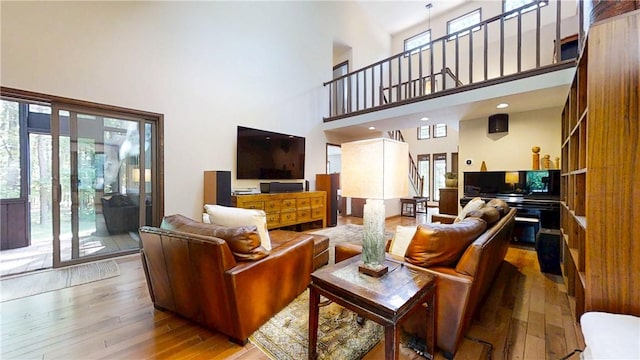 2657 Spencer Hill Rd, Corning, NY 14830 - living area featuring wood-type flooring and a high ceiling
