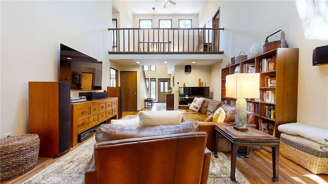 2657 Spencer Hill Rd, Corning, NY 14830 - living room featuring wood finished floors and a high ceiling