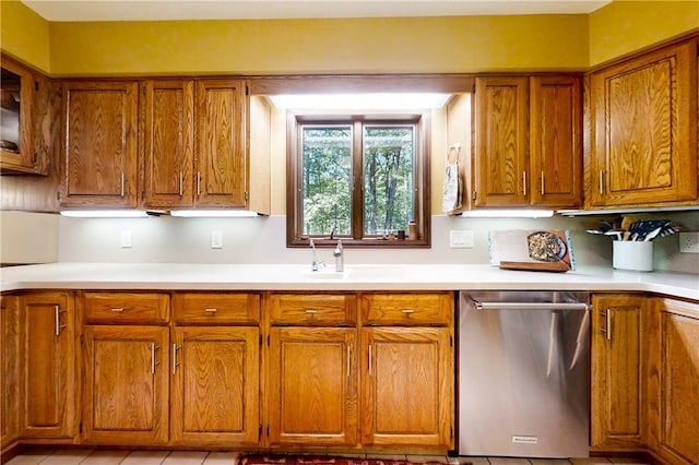 2657 Spencer Hill Rd, Corning, NY 14830 - kitchen featuring stainless steel dishwasher, brown cabinetry, and light countertops