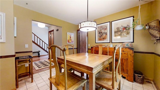 2657 Spencer Hill Rd, Corning, NY 14830 - dining room featuring light tile patterned floors and stairs