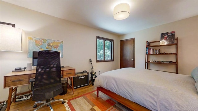 2657 Spencer Hill Rd, Corning, NY 14830 - bedroom featuring light wood-type flooring, a desk, and a closet
