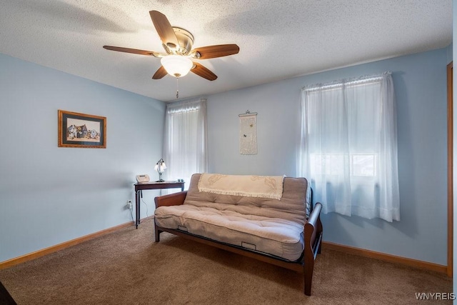 86 Hitching Post Ln, Amherst, NY 14228 - living area featuring a ceiling fan, plenty of natural light, carpet, and a textured ceiling