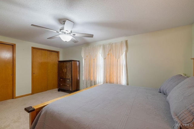 86 Hitching Post Ln, Amherst, NY 14228 - carpeted bedroom with ceiling fan, multiple closets, and a textured ceiling