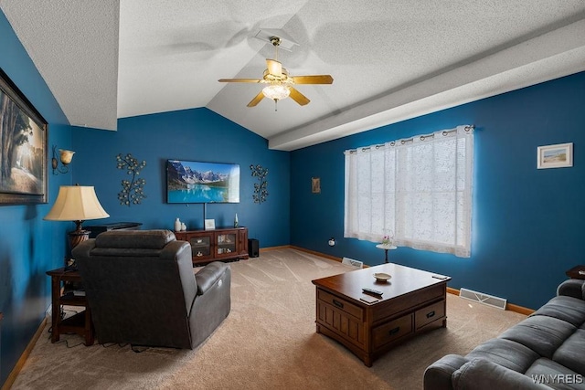 86 Hitching Post Ln, Amherst, NY 14228 - carpeted living area featuring ceiling fan, vaulted ceiling, and a textured ceiling