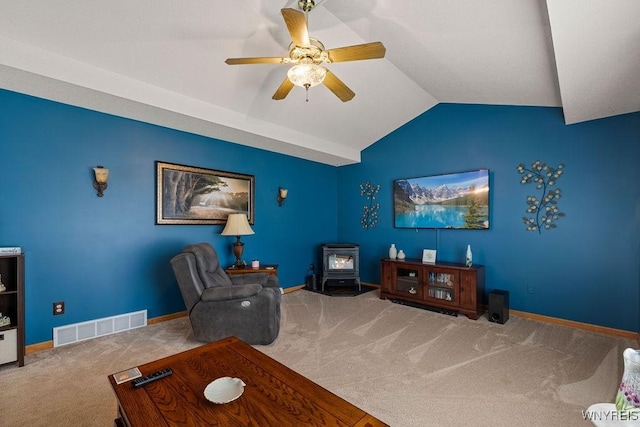 86 Hitching Post Ln, Amherst, NY 14228 - carpeted living area featuring a wood stove, lofted ceiling, and ceiling fan