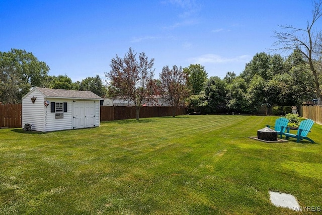86 Hitching Post Ln, Amherst, NY 14228 - fenced backyard with a fire pit and a shed