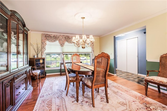 22 Red Leaf Dr, Chili, NY 14624 - dining room featuring a chandelier, wood finished floors, and ornamental molding