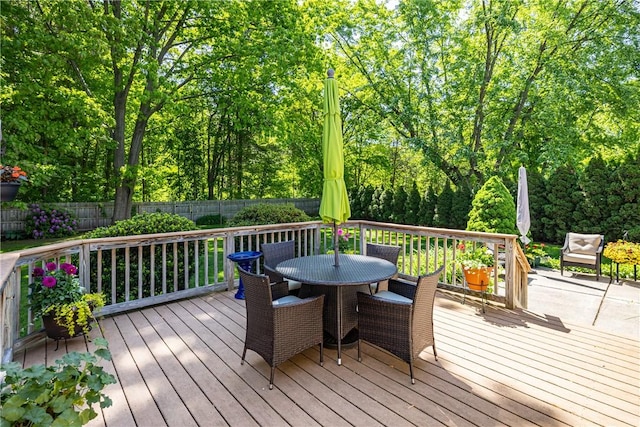 22 Red Leaf Dr, Chili, NY 14624 - wooden deck with outdoor dining area and a fenced backyard