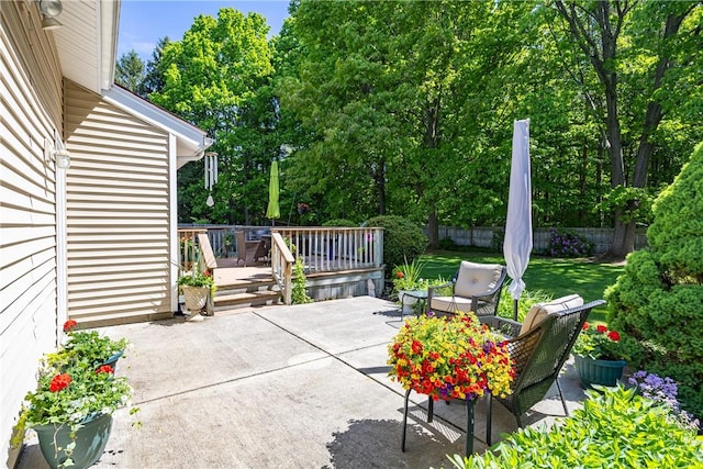 22 Red Leaf Dr, Chili, NY 14624 - view of patio with a deck and view of wooded area