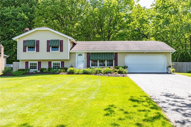 22 Red Leaf Dr, Chili, NY 14624 - tri-level home featuring a garage and asphalt driveway