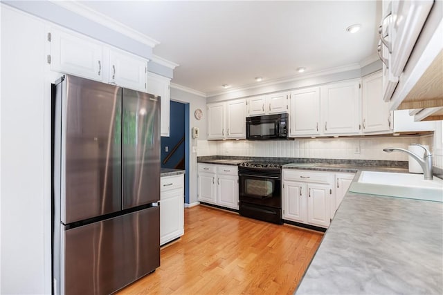 22 Red Leaf Dr, Chili, NY 14624 - kitchen with black appliances, decorative backsplash, white cabinetry, ornamental molding, and light wood-style flooring